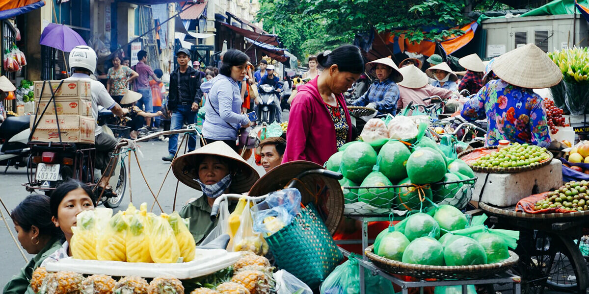 Capture the vibrant energy of Hue’s market bargaining